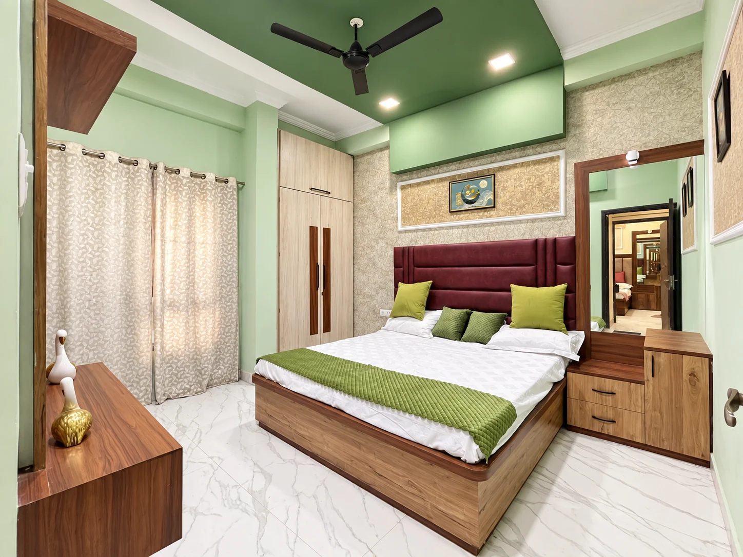 Sanskriti Kunj flat bedroom with green feature wall